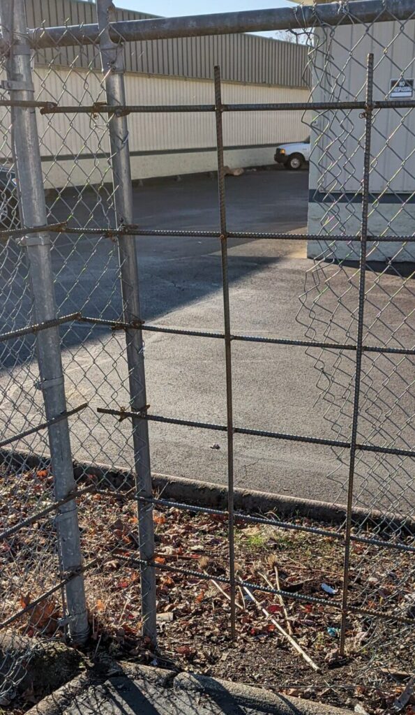 Security reinforced cyclone fence